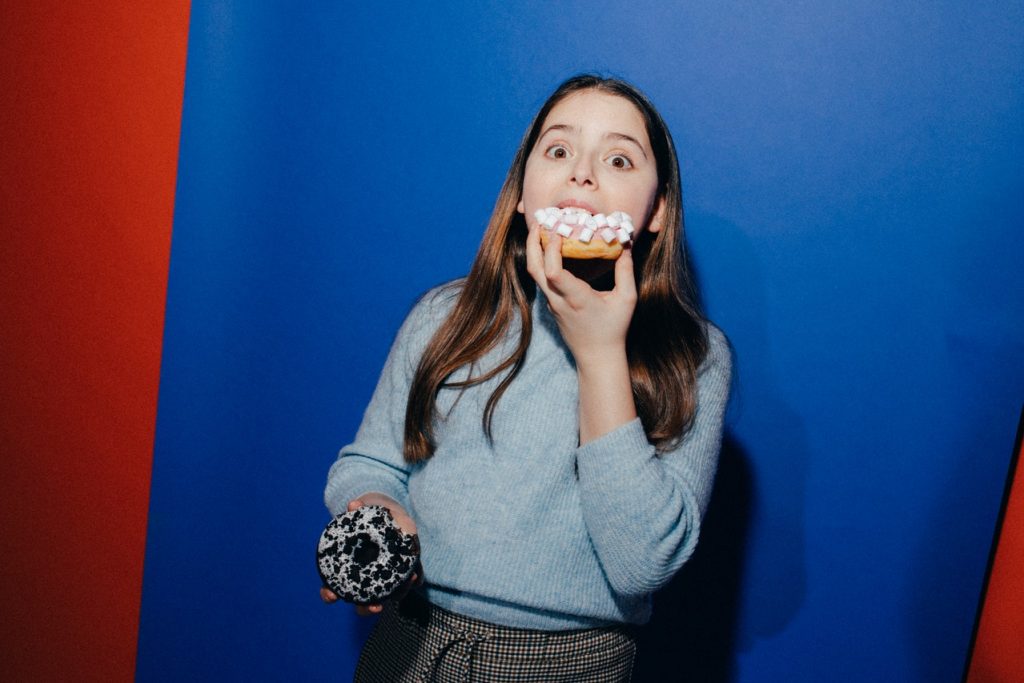 woman eating donuts