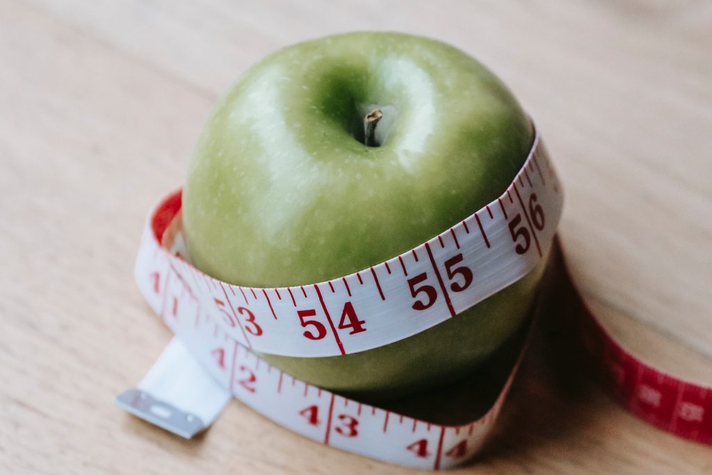 apple and a measuring tape